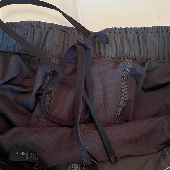 Lululemon Surge 6” Lined Gray Reflective Shorts - Picture 10 of 11